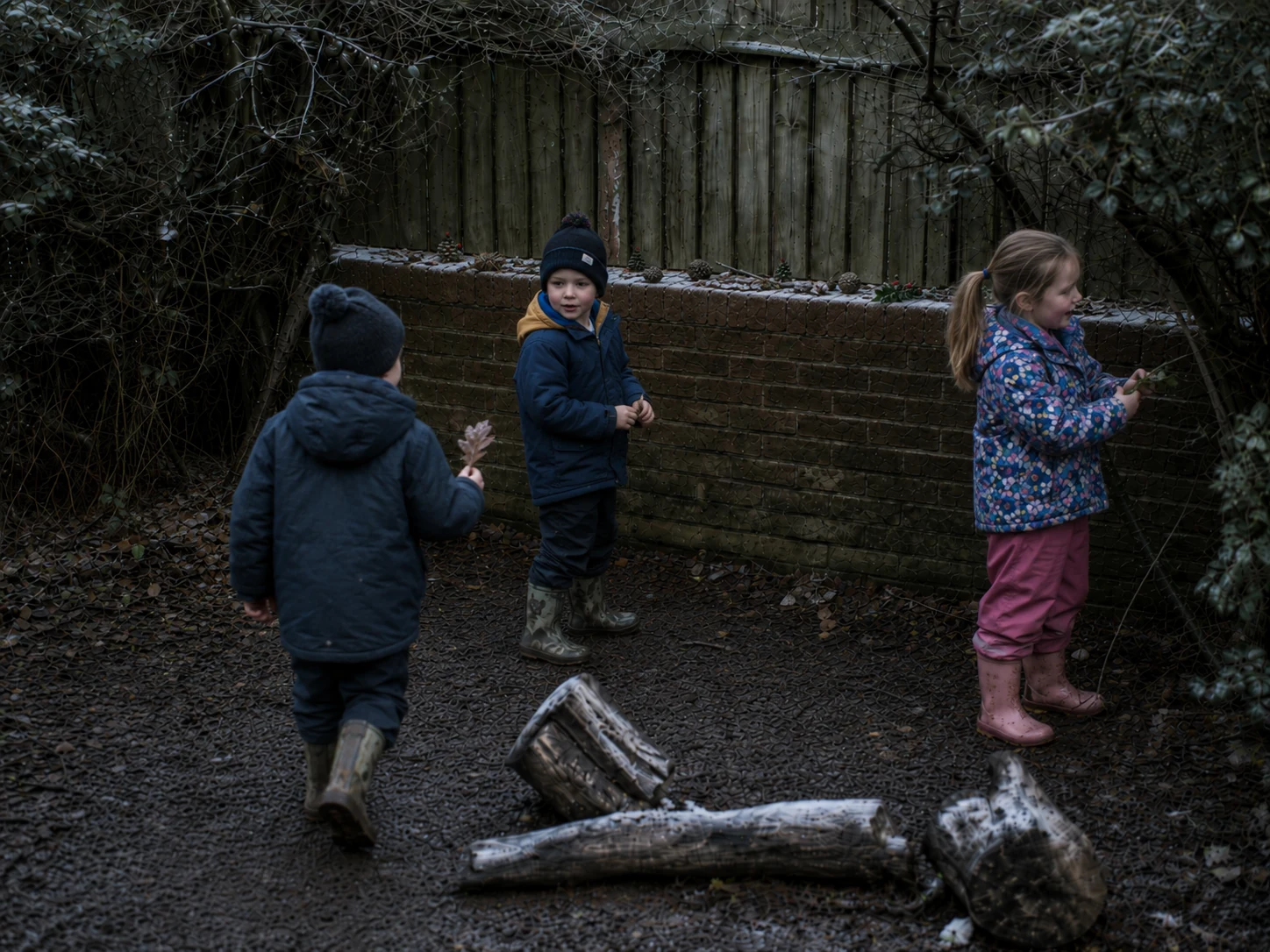 Children exploring their woodland shop during winter